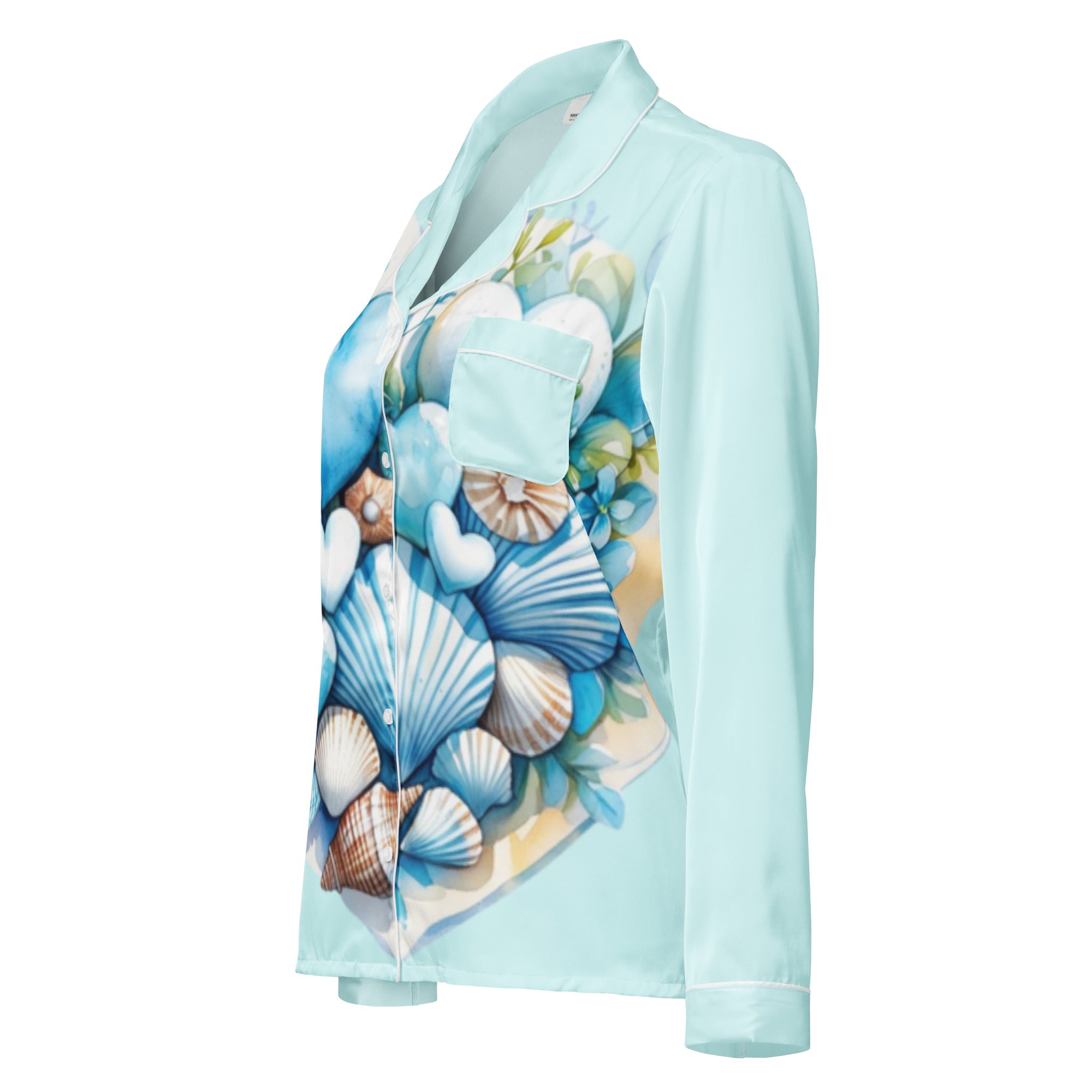 Woman in Coastal Hearts pajama top with blue hearts and shells design peaceful morning coastal lifestyle