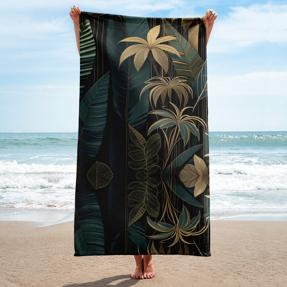 emerald and gold art deco beach towel on wooden deck in jungle setting