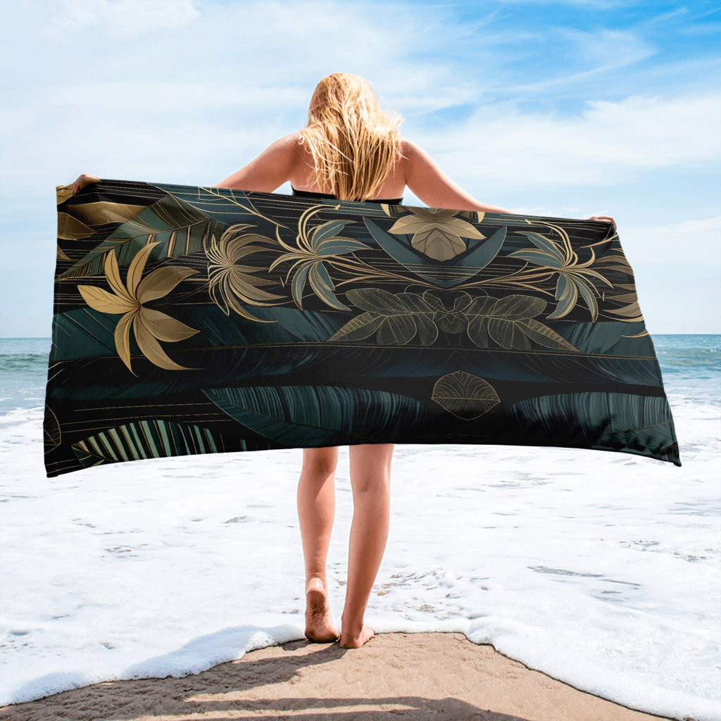 emerald and gold art deco beach towel on wooden deck in jungle setting