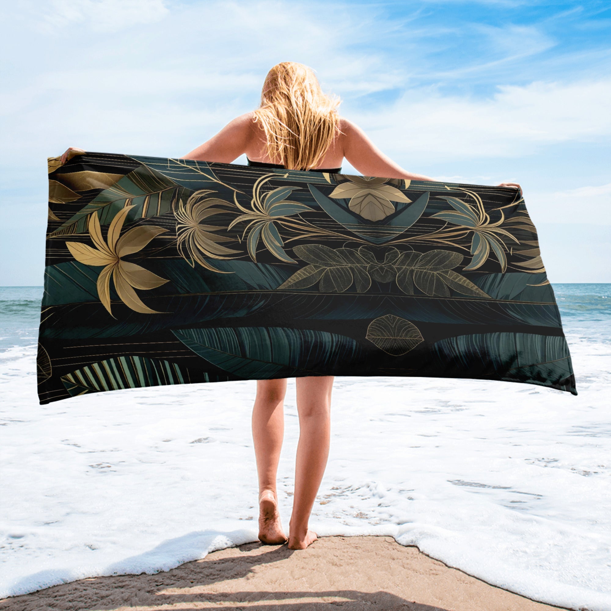 emerald and gold art deco beach towel on wooden deck in jungle setting