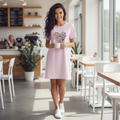 Beautiful woman in pink t-shirt dress with hearts in modern cafe