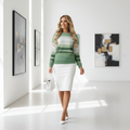 Confident blonde woman in green sweatshirt with white pencil skirt