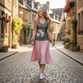 Stylish woman in cherry blossom tank top with pink skirt walking through city